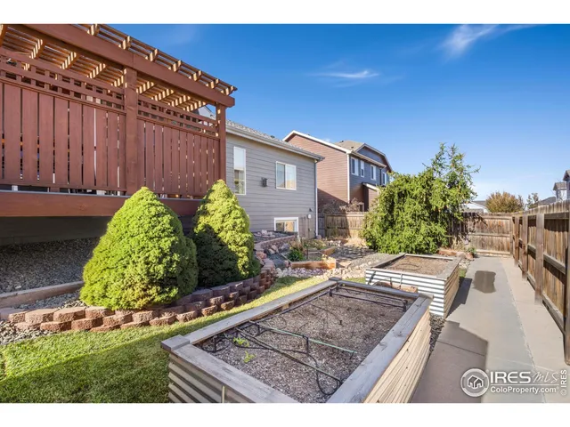 a view of a backyard with sitting area