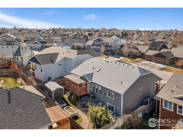 an aerial view of a house with a city view