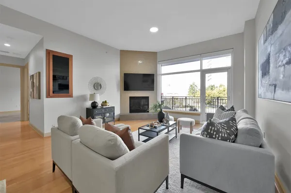 a living room with furniture and a fireplace