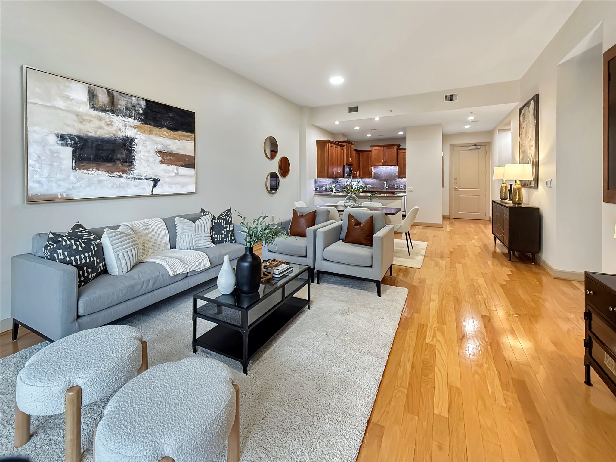 3 Waterway Court, Unit 2B Spring, TX 77380 - Photo 11 of 46 a living room with furniture and a flat screen tv