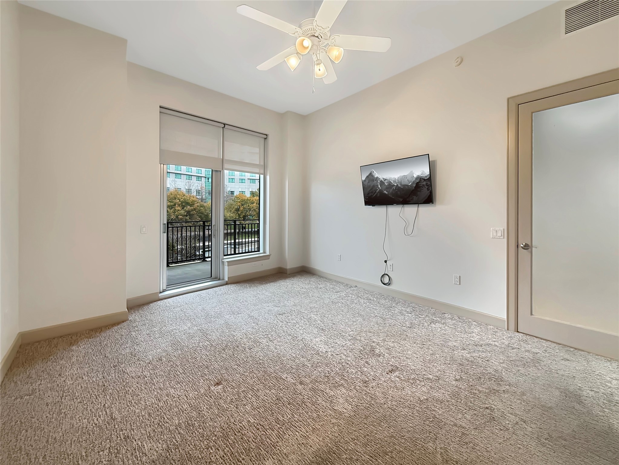 3 Waterway Court, Unit 2B Spring, TX 77380 - Photo 16 of 46 a view of an empty room with a window