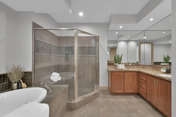 a bathroom with a bathtub and a shower