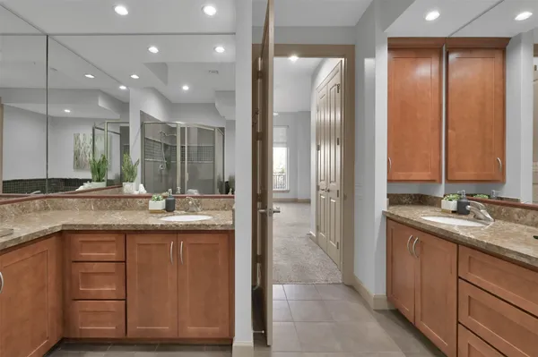 a view of a walk in closet and living room
