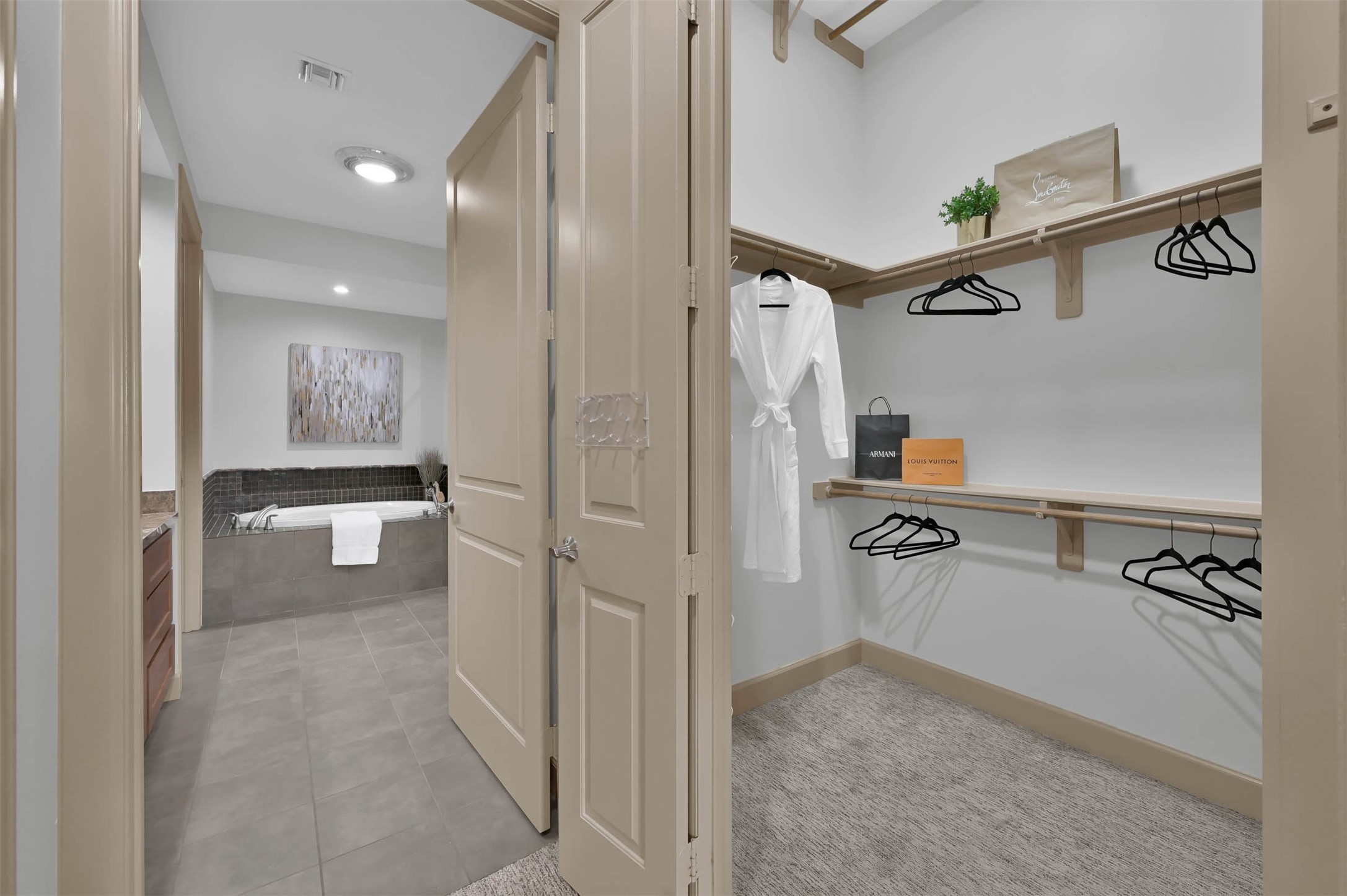 3 Waterway Court, Unit 2B Spring, TX 77380 - Photo 23 of 46 a view of a walk in closet and living room