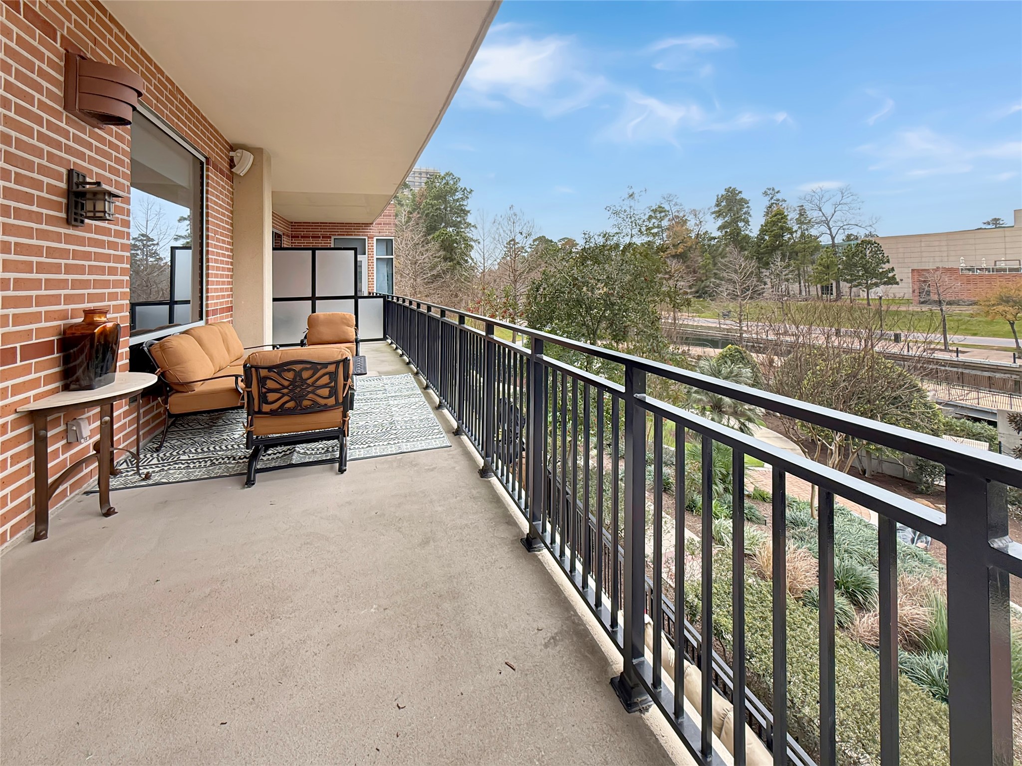 3 Waterway Court, Unit 2B Spring, TX 77380 - Photo 31 of 46 a balcony with outdoor seating and city view