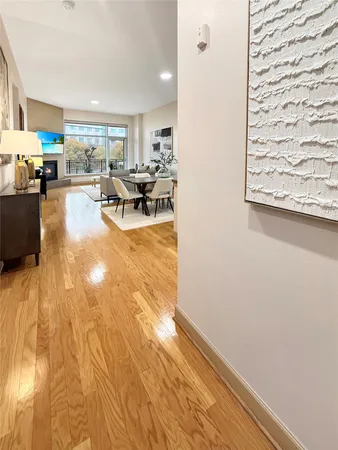 a view of a dining room with furniture and chandelier