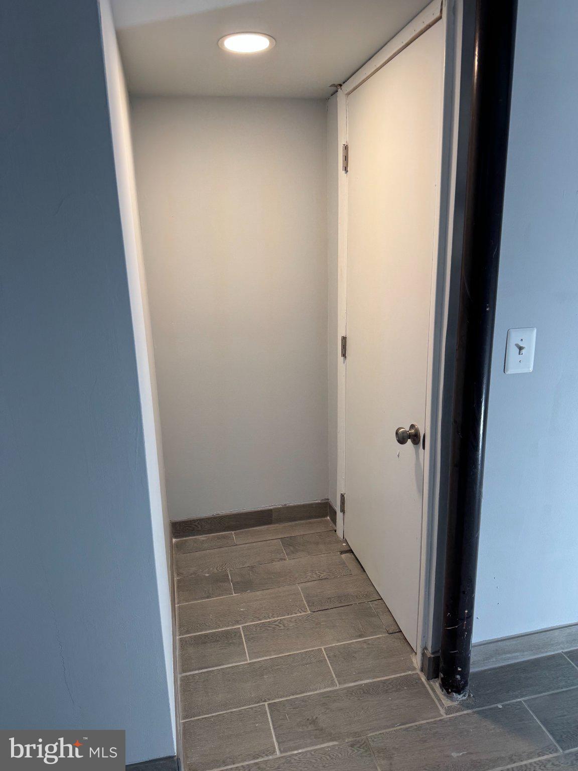 6603 Huntsman Boulevard Springfield, VA 22152 - Photo 42 of 64 Inviting entryway with modern tiles.
