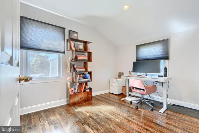 a workspace with furniture and a book shelf
