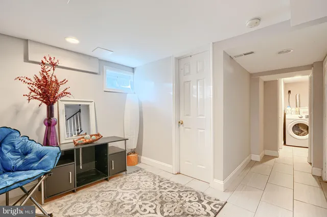 a living room with furniture and a rug