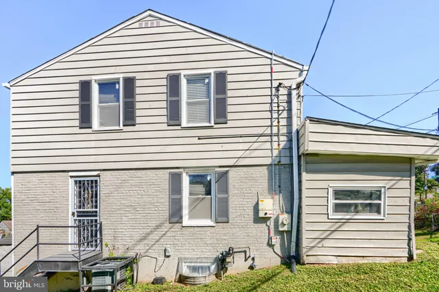 a view of a garden with a building in the background