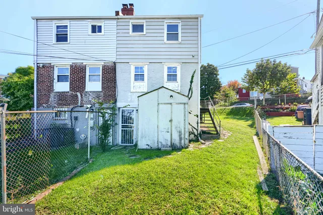 a view of a backyard with sitting area