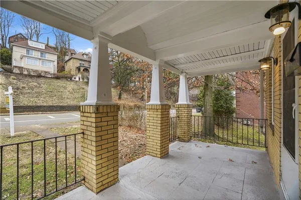 a view of a porch with a floor to ceiling window