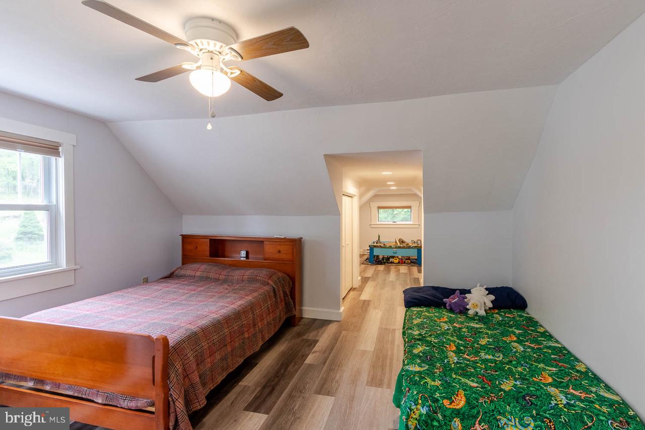 1834 Decker Hollow Road Tyrone, PA 16686 - Photo 31 of 40 a bedroom with a bed and a chandelier