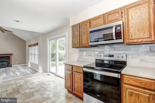 a kitchen with a stove and a microwave