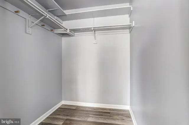 a bathroom with a granite countertop sink a toilet and a bathtub