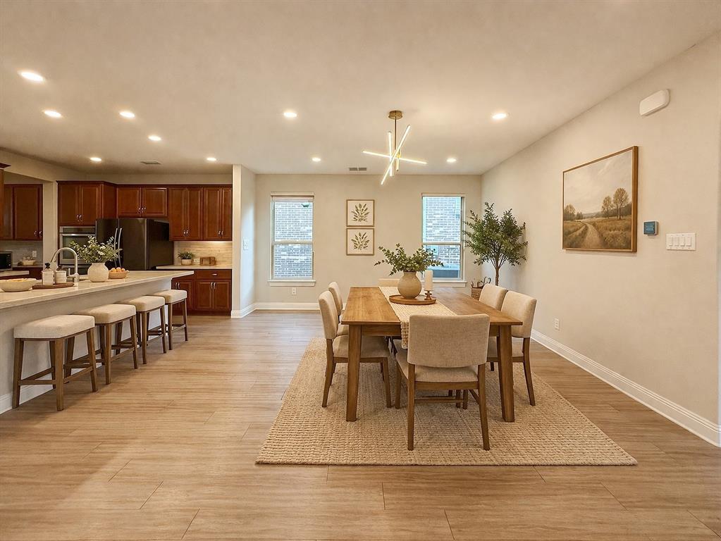 9829 Sharps Road Frisco, TX 75035 - Photo 13 of 40 Dining space featuring recessed lighting and light wood finished floors