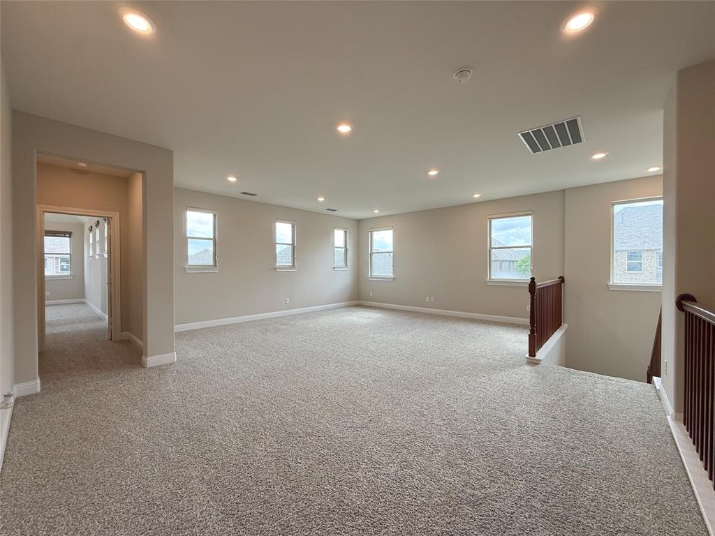 9829 Sharps Road Frisco, TX 75035 - Photo 16 of 40 Spare room featuring light colored carpet and recessed lighting