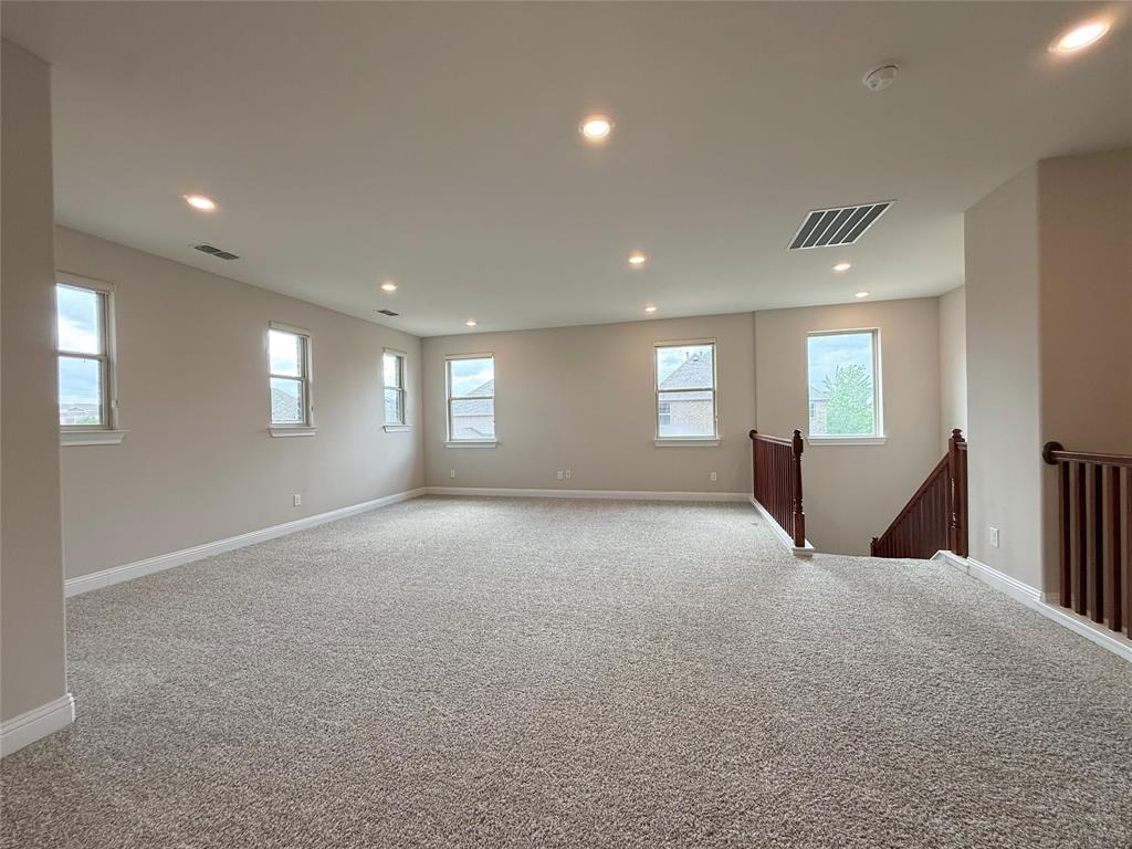 9829 Sharps Road Frisco, TX 75035 - Photo 25 of 40 Carpeted empty room featuring recessed lighting and healthy amount of natural light