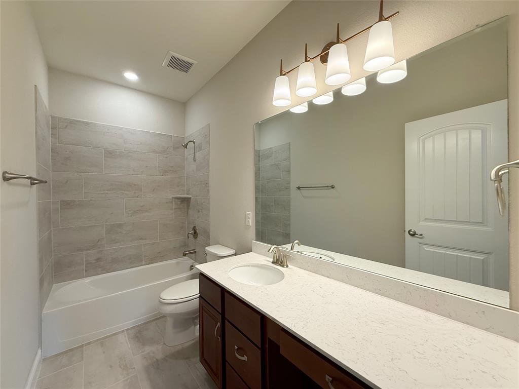9829 Sharps Road Frisco, TX 75035 - Photo 30 of 40 Bathroom with vanity and shower combination