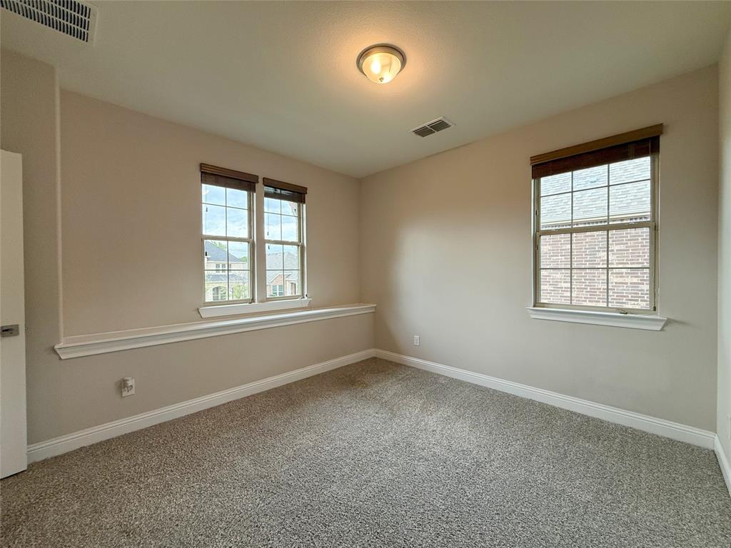 9829 Sharps Road Frisco, TX 75035 - Photo 31 of 40 Spare room with carpet floors and plenty of natural light