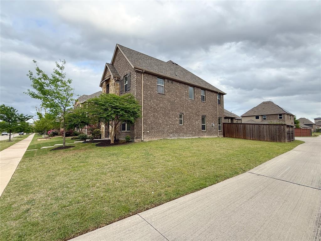 9829 Sharps Road Frisco, TX 75035 - Photo 36 of 40 View of side of property featuring brick siding and a shingled roof