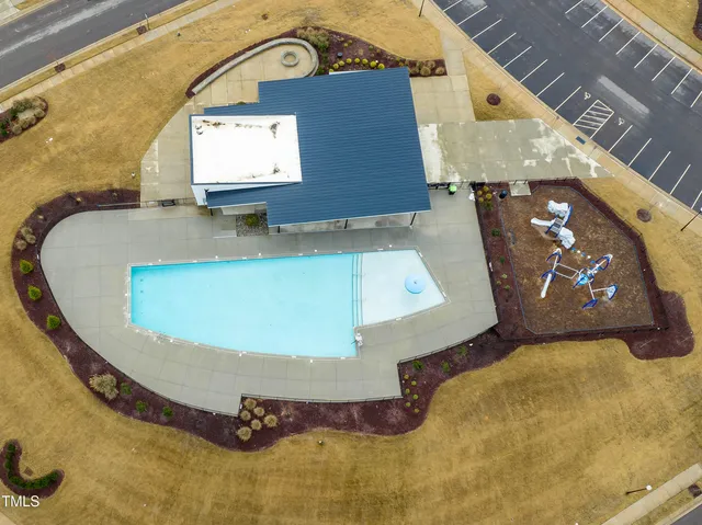 an aerial view of a house with a swimming pool