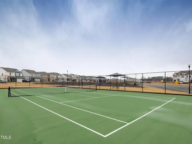 an aerial view of a house with a big yard