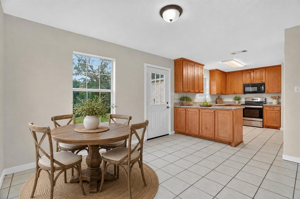 Virtually staged dining to kitchen.