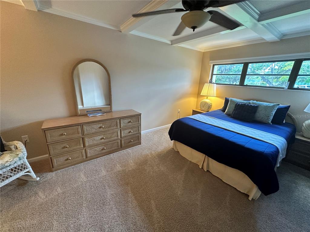 4572 Red Maple, Unit 901 Bradenton, FL 34210 - Photo 11 of 30 a bedroom with a bed and a dresser