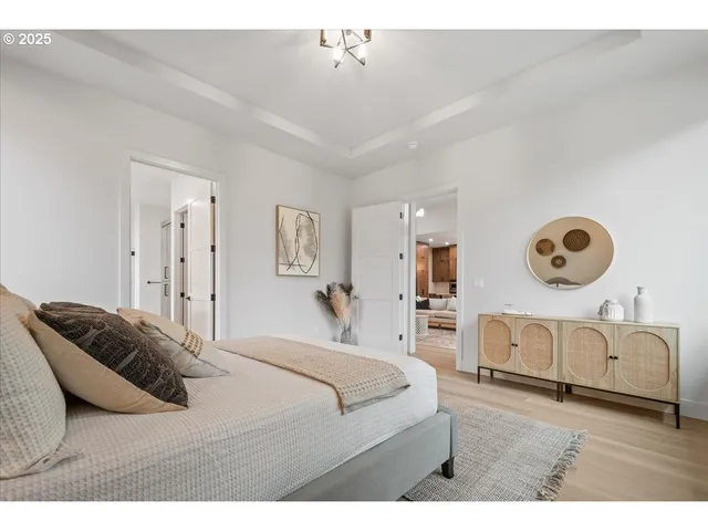 a bedroom with a bed and ceiling fan