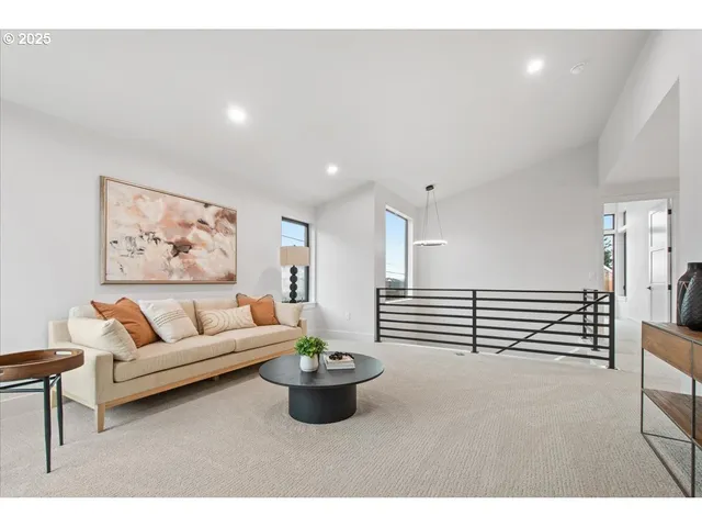 a living room with furniture and white walls
