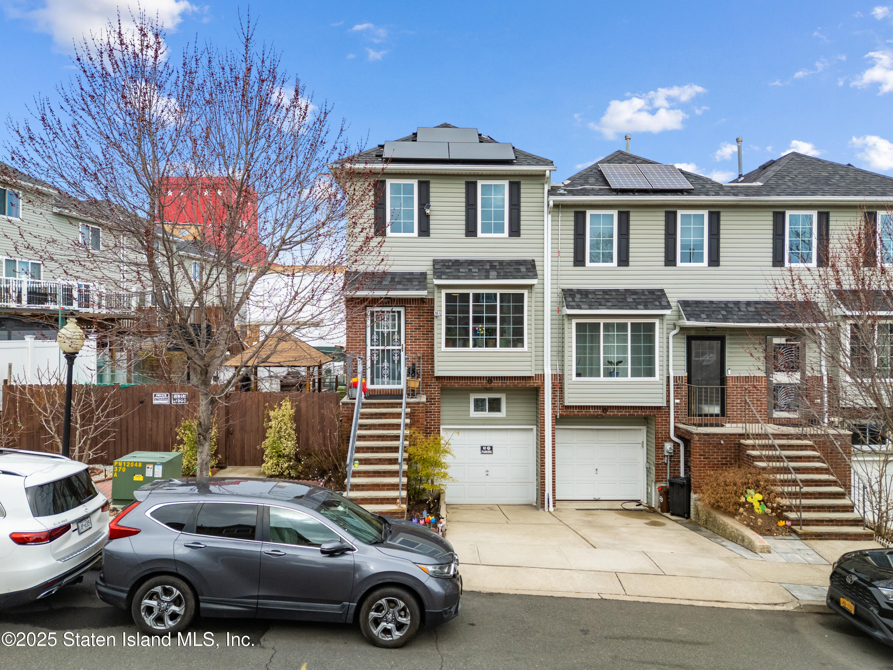 41 Burgundy Loop Staten Island, NY 10304 - Photo 1 of 29 a car parked in front of a house