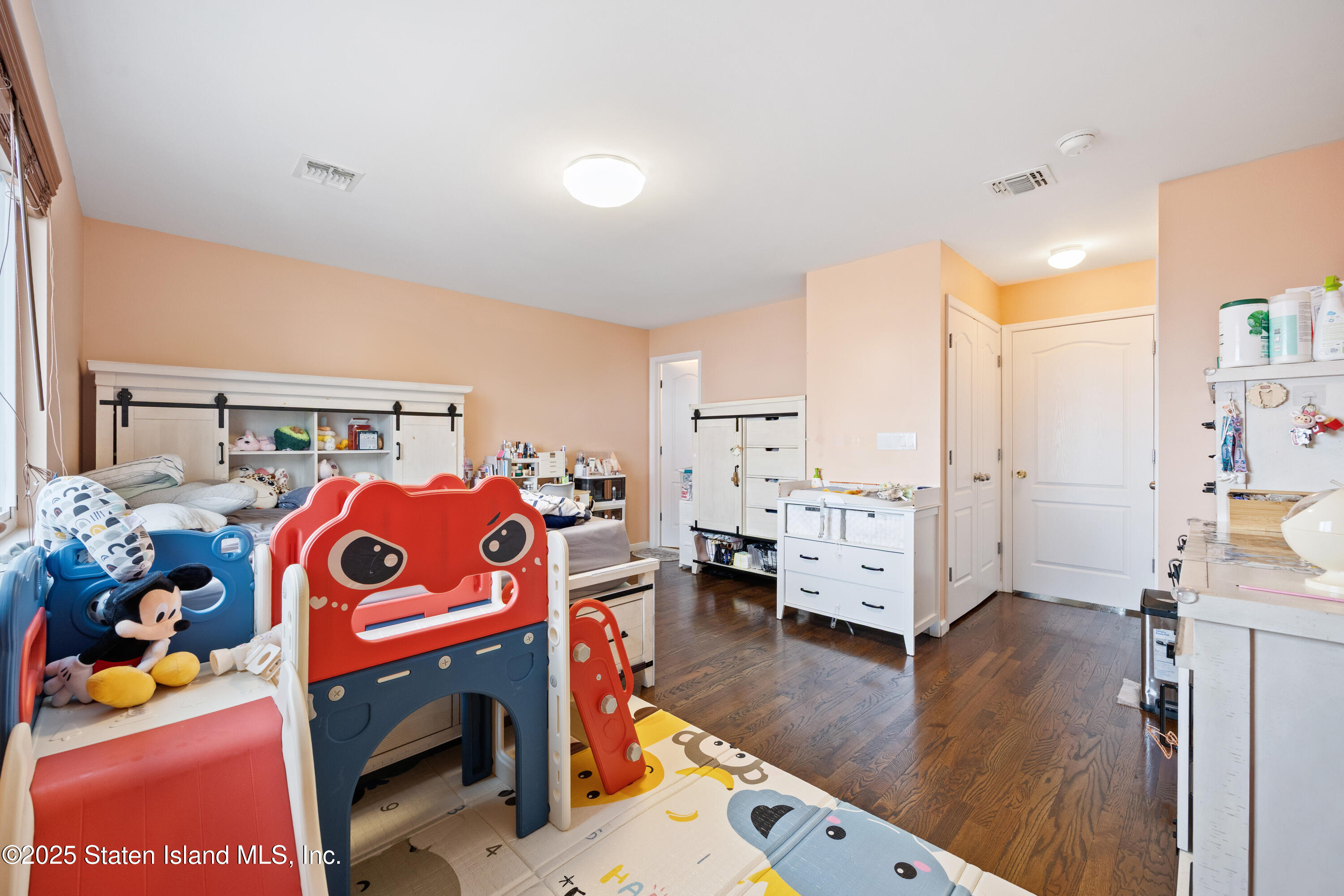 41 Burgundy Loop Staten Island, NY 10304 - Photo 14 of 29 a living room filled with furniture and a wooden floor