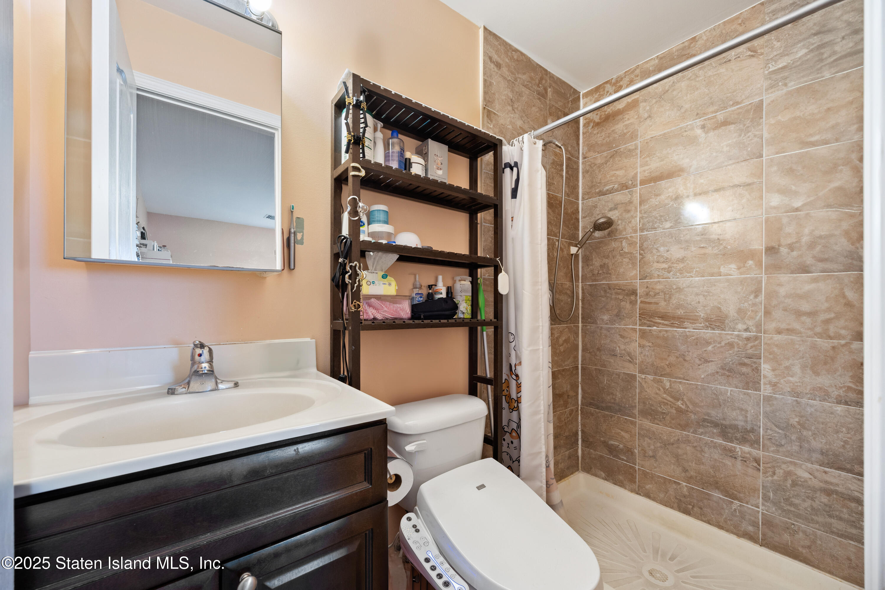 41 Burgundy Loop Staten Island, NY 10304 - Photo 15 of 29 a bathroom with a sink toilet and shower