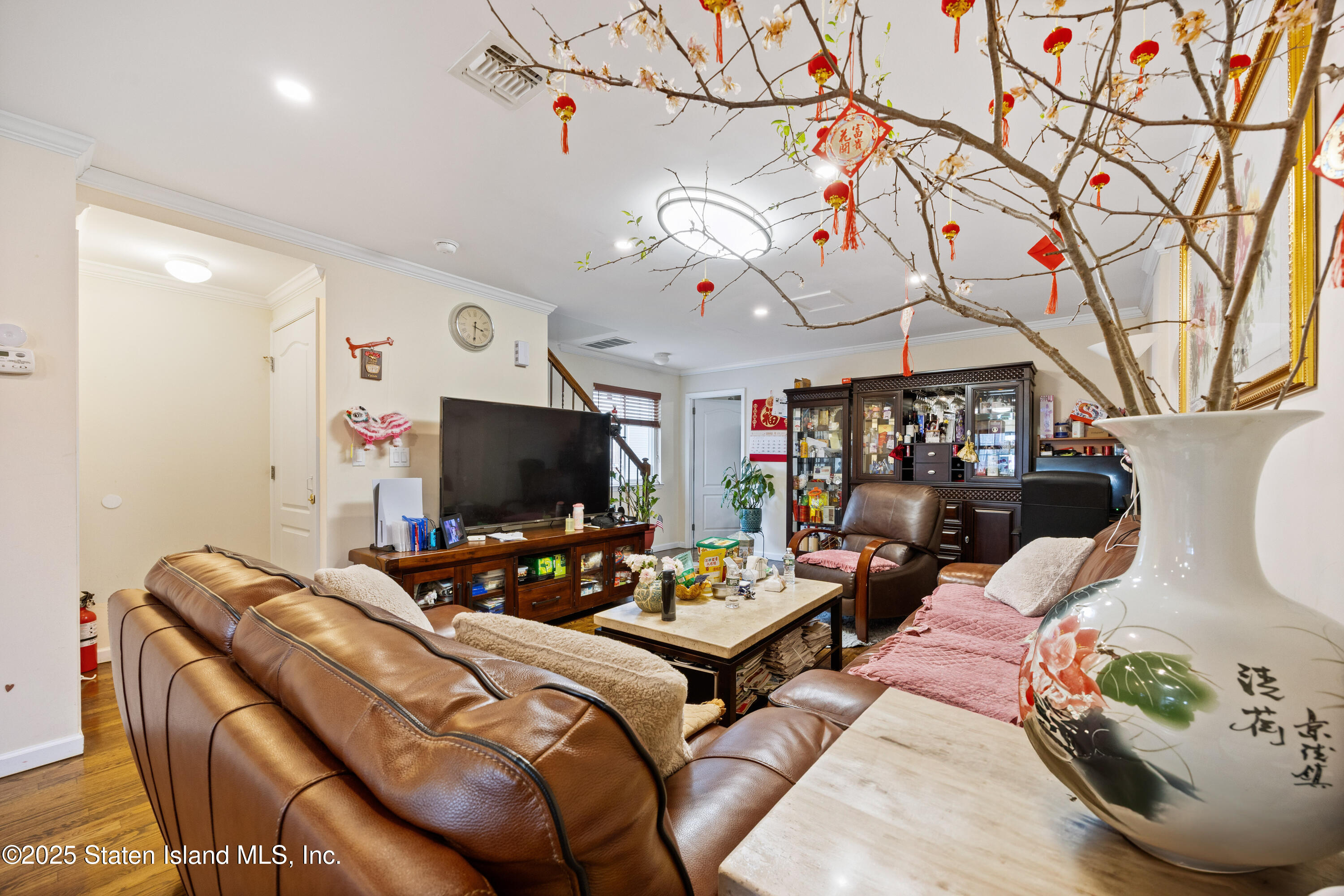 41 Burgundy Loop Staten Island, NY 10304 - Photo 4 of 29 a living room with patio furniture and a flat screen tv