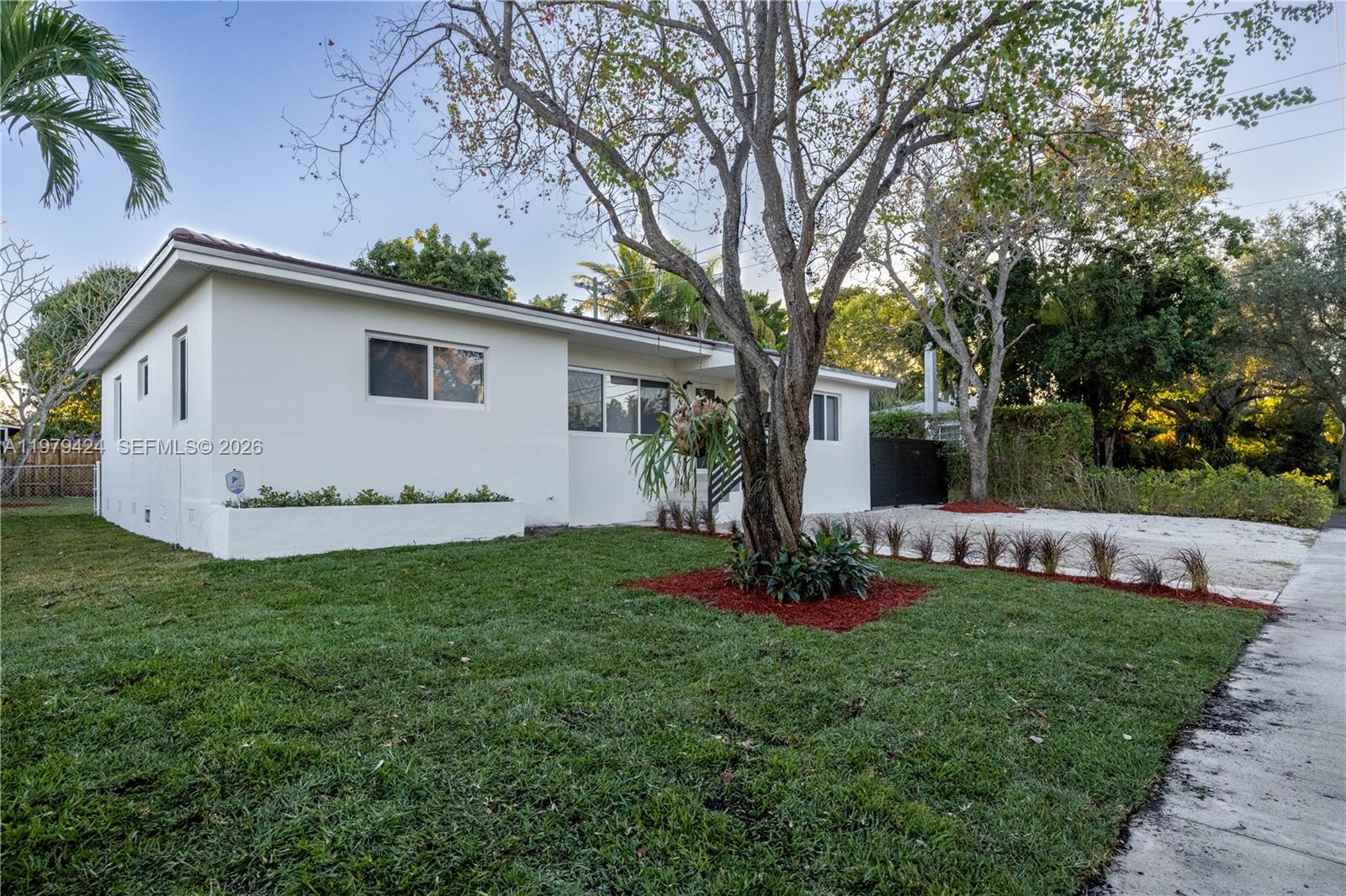 a view of a house with a yard