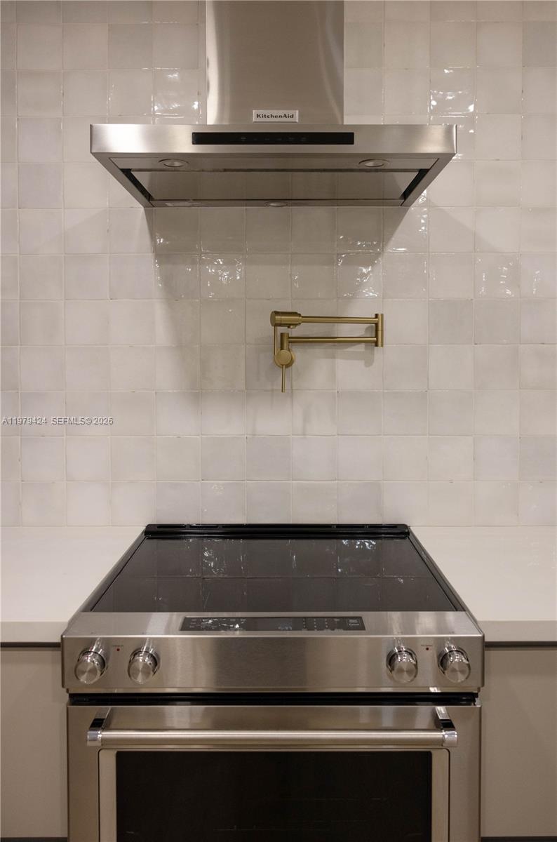 6070 Southwest 42nd Street Miami, FL 33155 - Photo 13 of 40 a stove top oven sitting inside of a kitchen