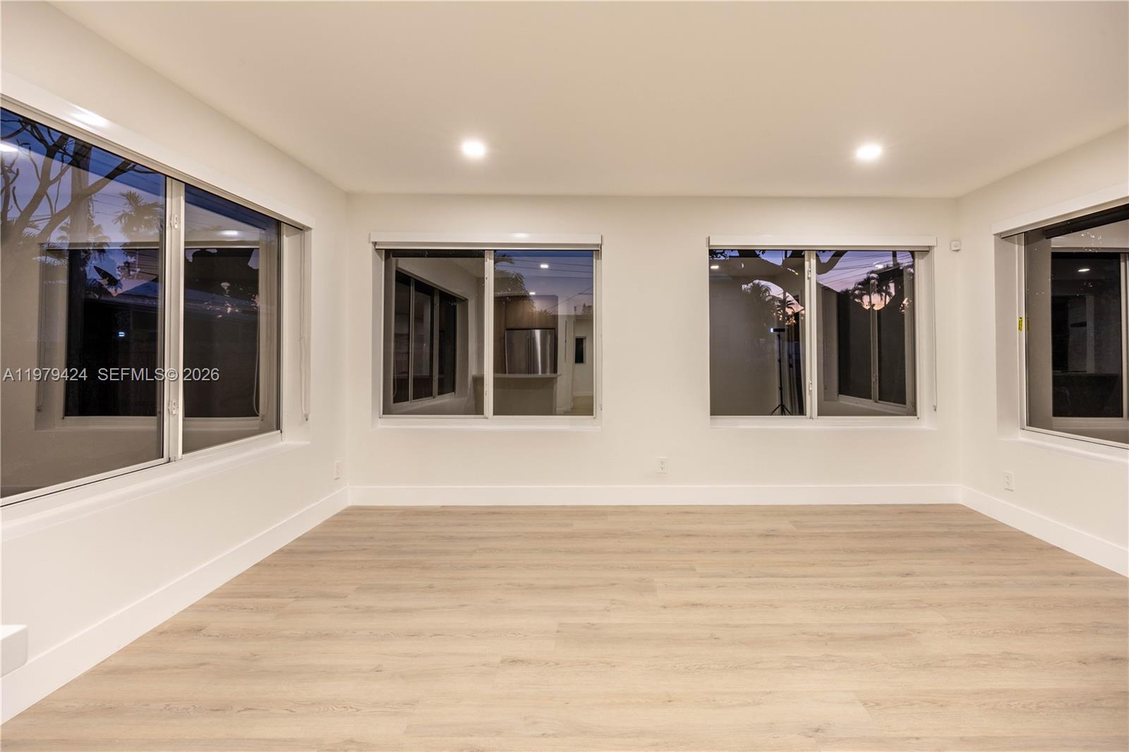 6070 Southwest 42nd Street Miami, FL 33155 - Photo 19 of 40 a view of a big room with wooden floor and windows