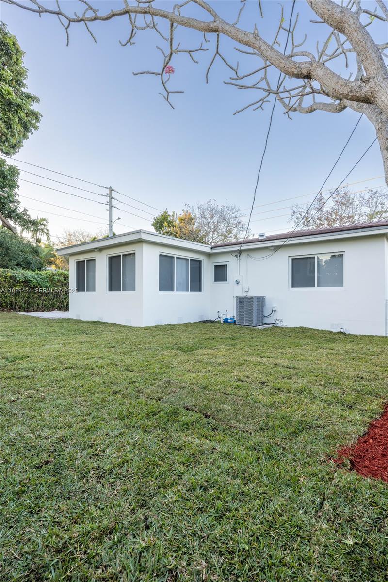 6070 Southwest 42nd Street Miami, FL 33155 - Photo 37 of 40 a view of a house with a backyard