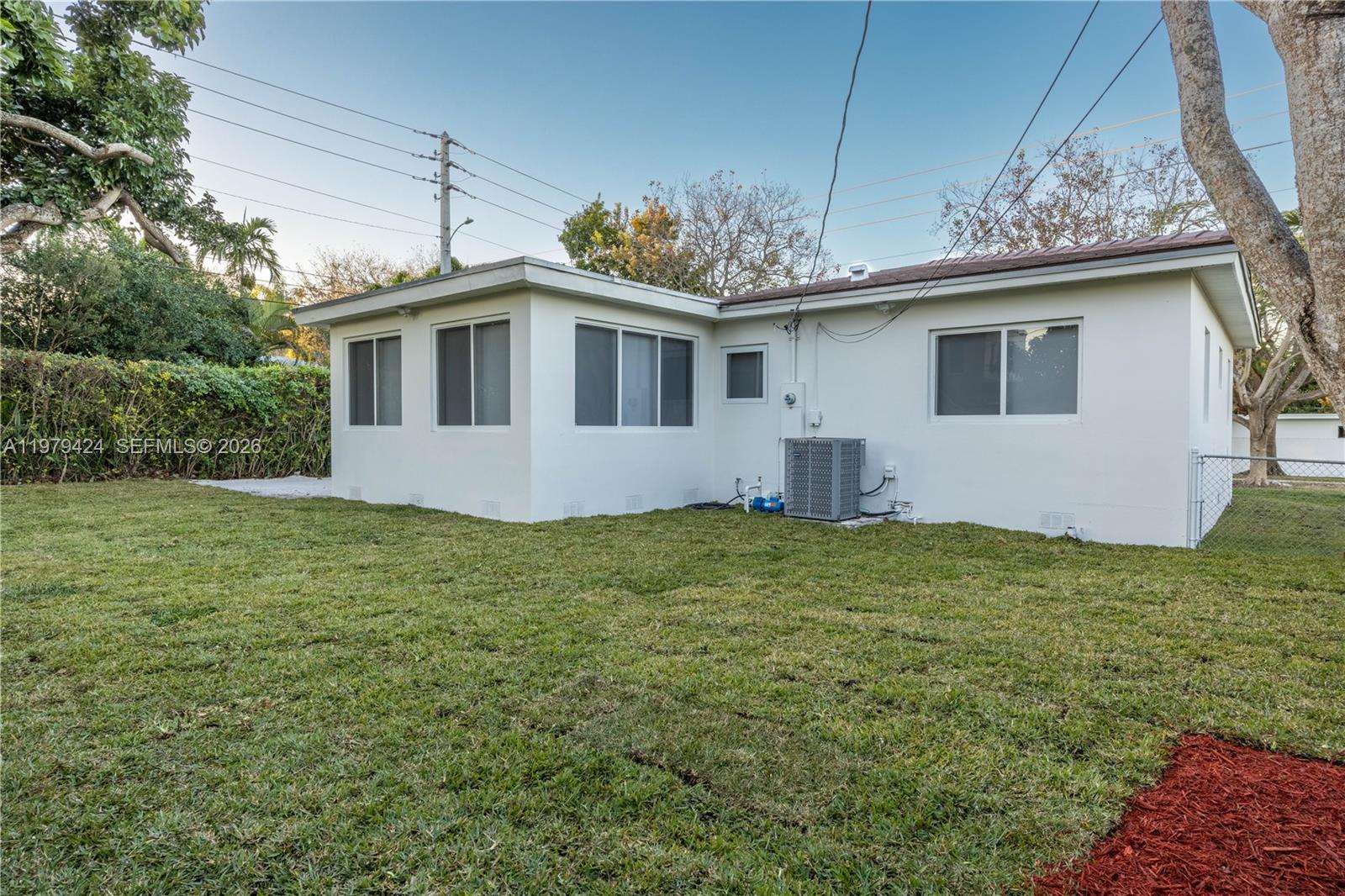 6070 Southwest 42nd Street Miami, FL 33155 - Photo 38 of 40 a house with trees in the background