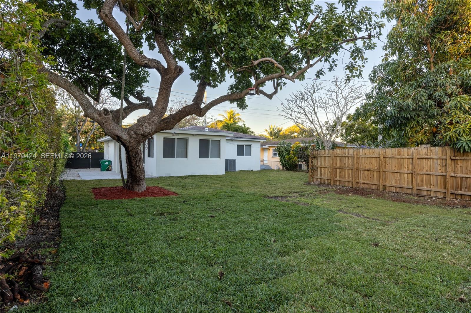 6070 Southwest 42nd Street Miami, FL 33155 - Photo 39 of 40 a view of a yard in front of a house with large trees