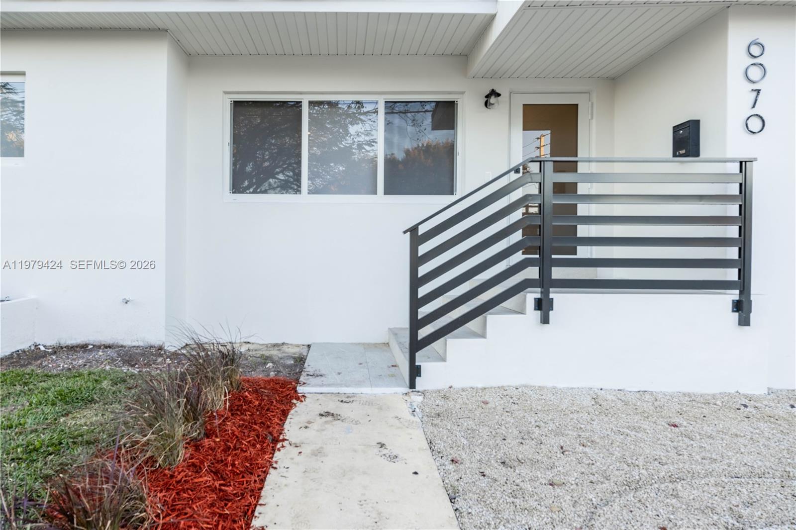 6070 Southwest 42nd Street Miami, FL 33155 - Photo 4 of 40 a view of entryway and hall