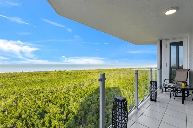 a spacious bathroom with a granite countertop sink a toilet a mirror and shower
