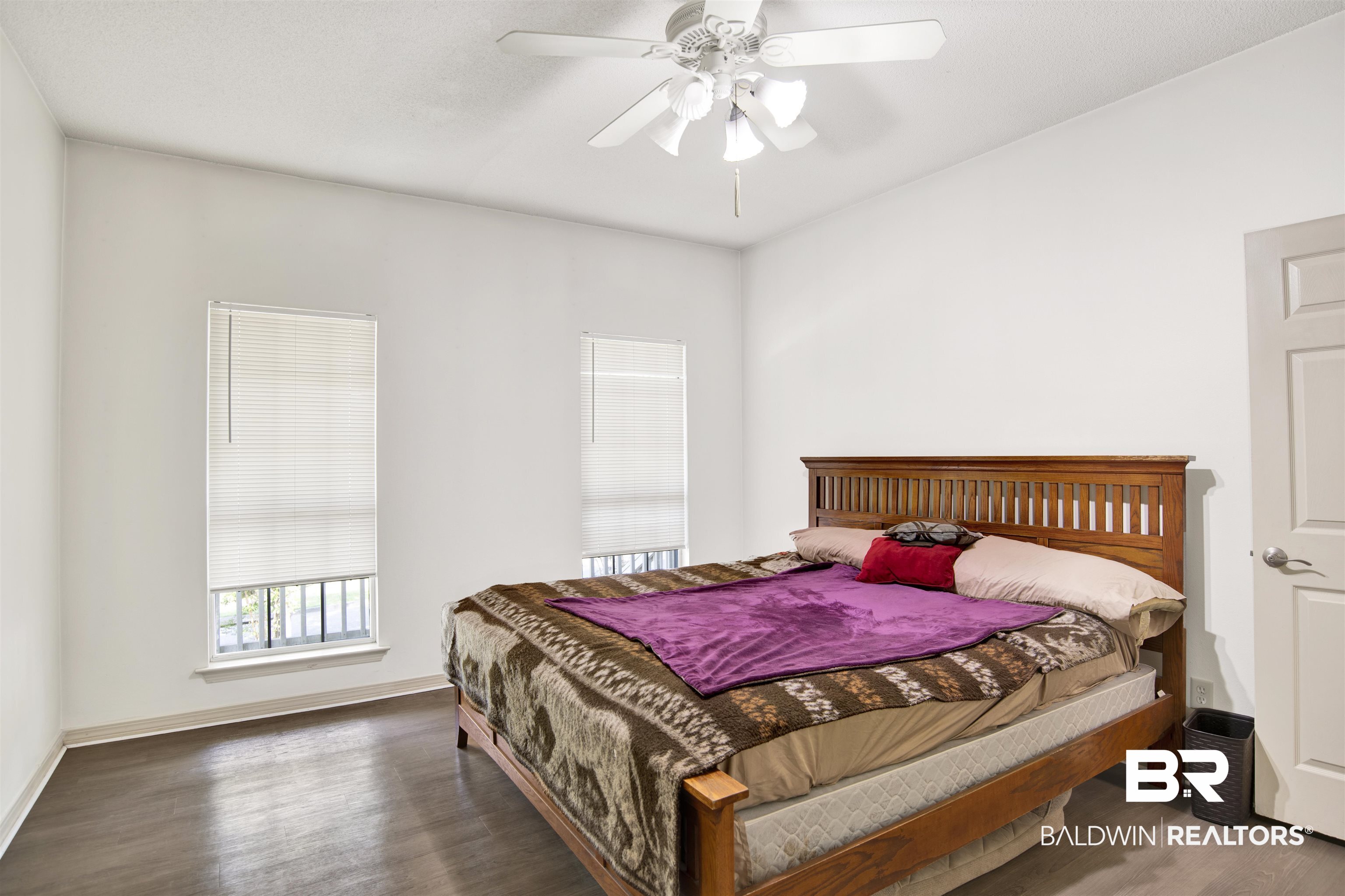 3412 Peyton Court Mobile, AL 36695 - Photo 17 of 27 Bedroom featuring wood finished floors, a ceiling fan, and baseboards