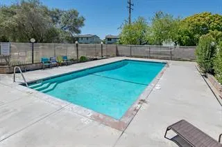a view of a backyard with a sitting area