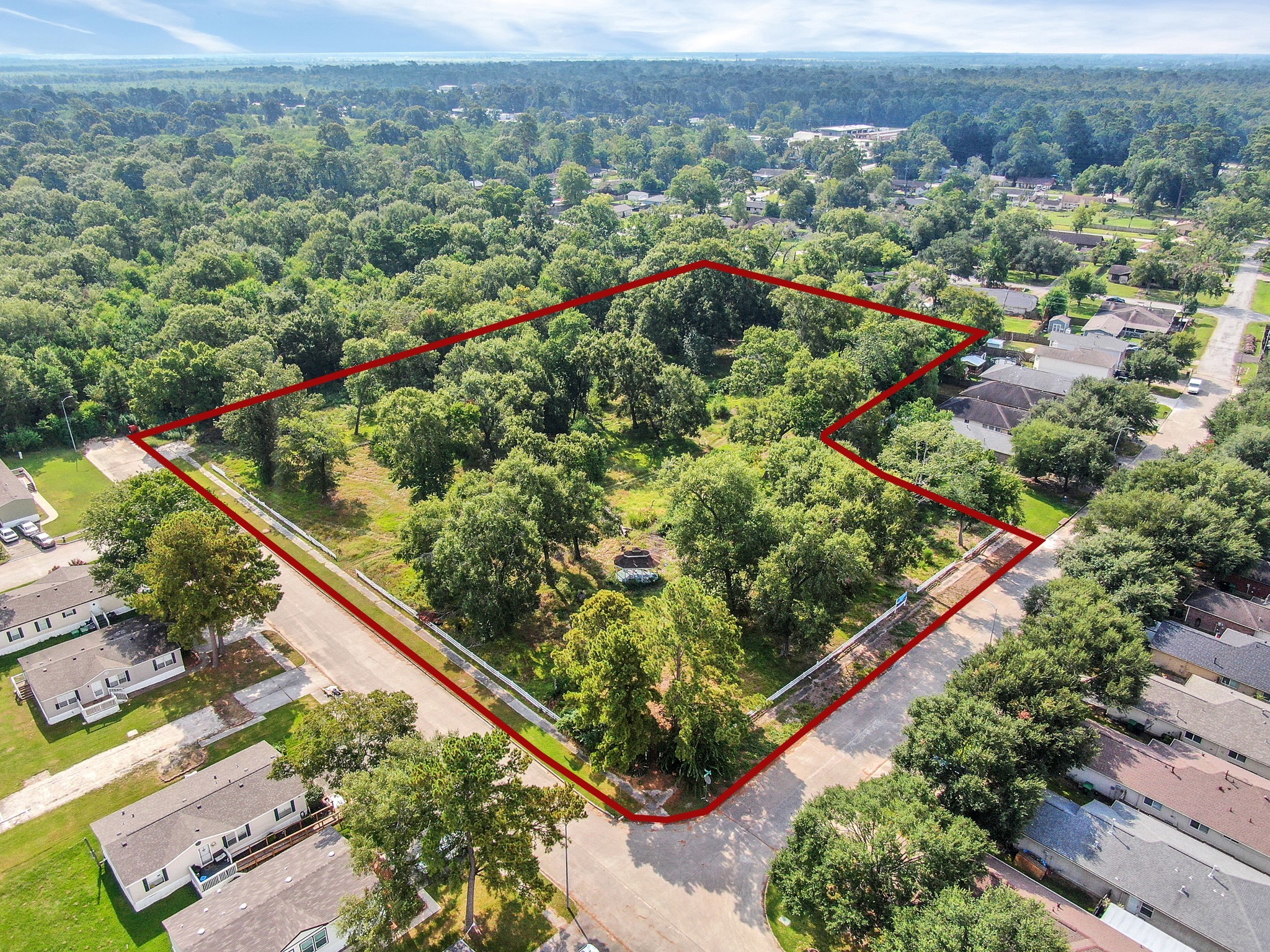 0 Silver Maple Drive Huffman, TX 77336 - Photo 10 of 14 an aerial view of green landscape with trees houses and mountain view