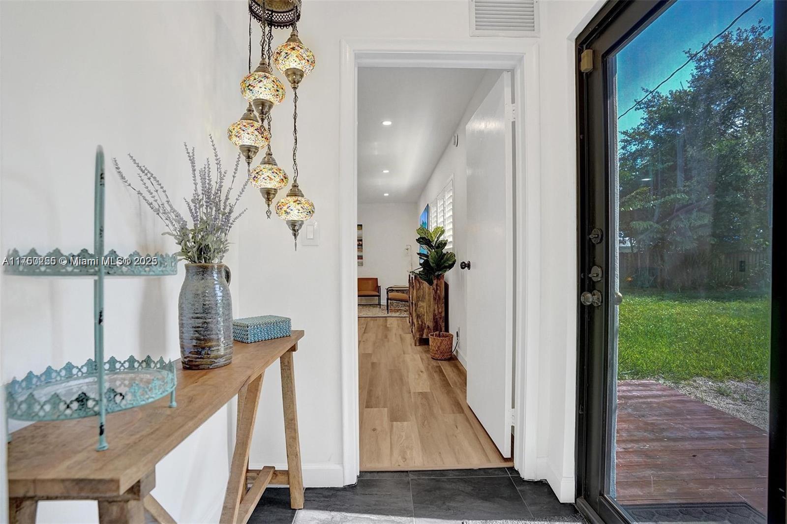 110 Southwest 5th Street Hallandale Beach, FL 33009 - Photo 11 of 26 a view of a hallway to a livingroom with furniture