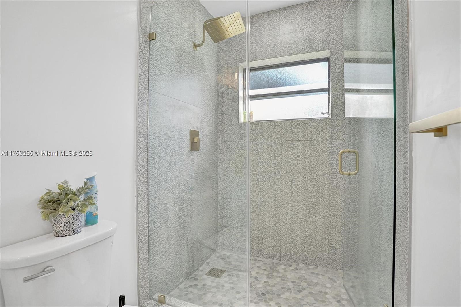 110 Southwest 5th Street Hallandale Beach, FL 33009 - Photo 12 of 26 a bathroom with a shower