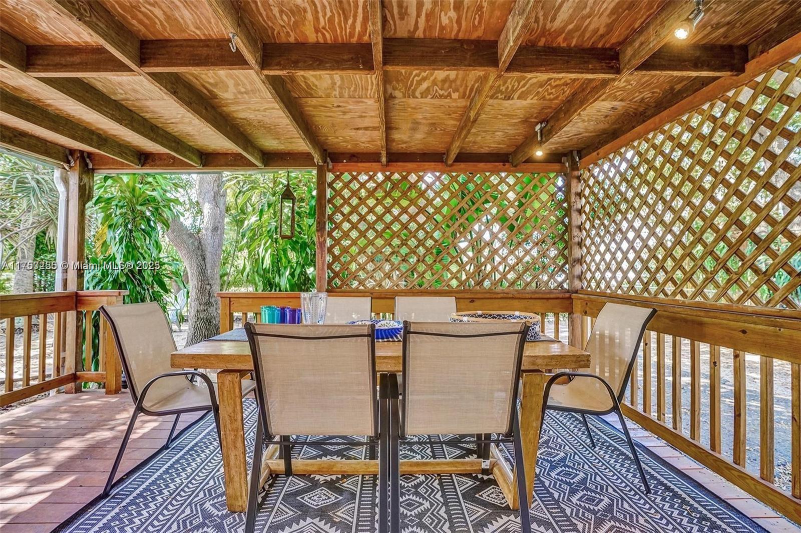 110 Southwest 5th Street Hallandale Beach, FL 33009 - Photo 20 of 26 a view of a chairs and table in the patio