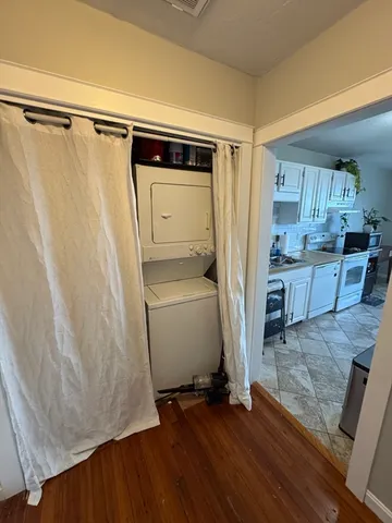 a view of kitchen with furniture and wooden floor